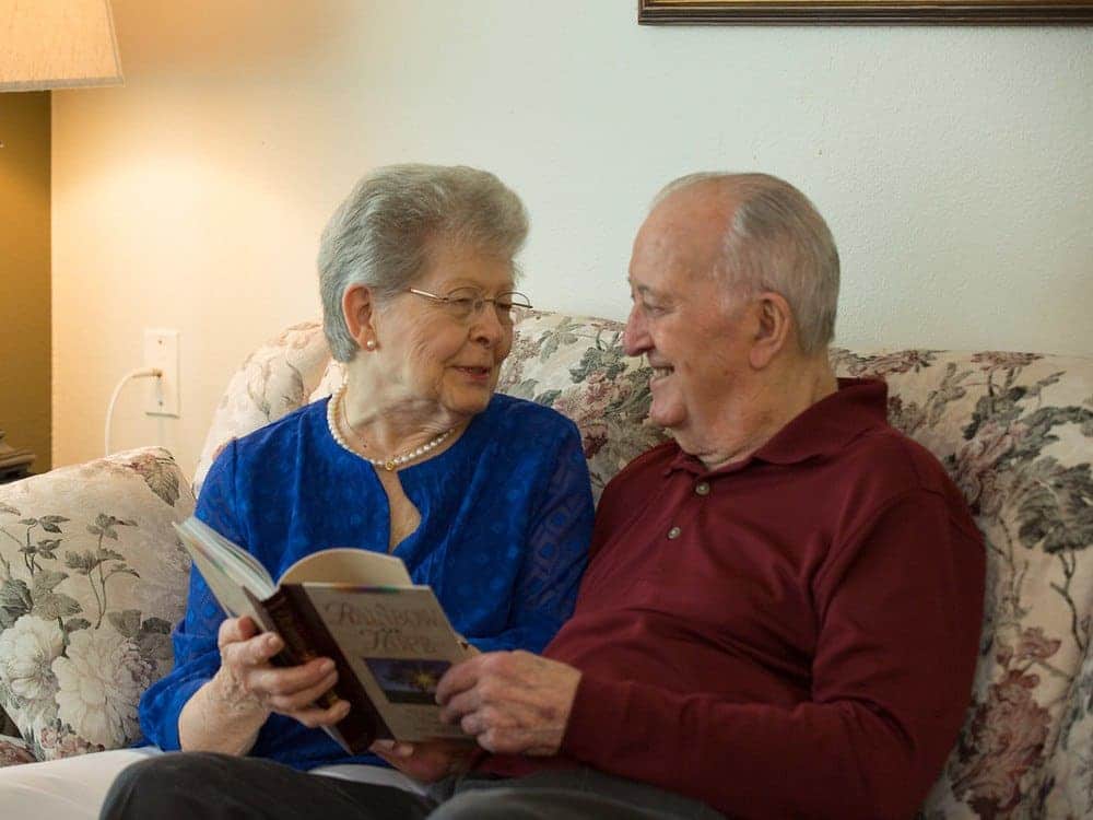 Residents Reading A Book Together