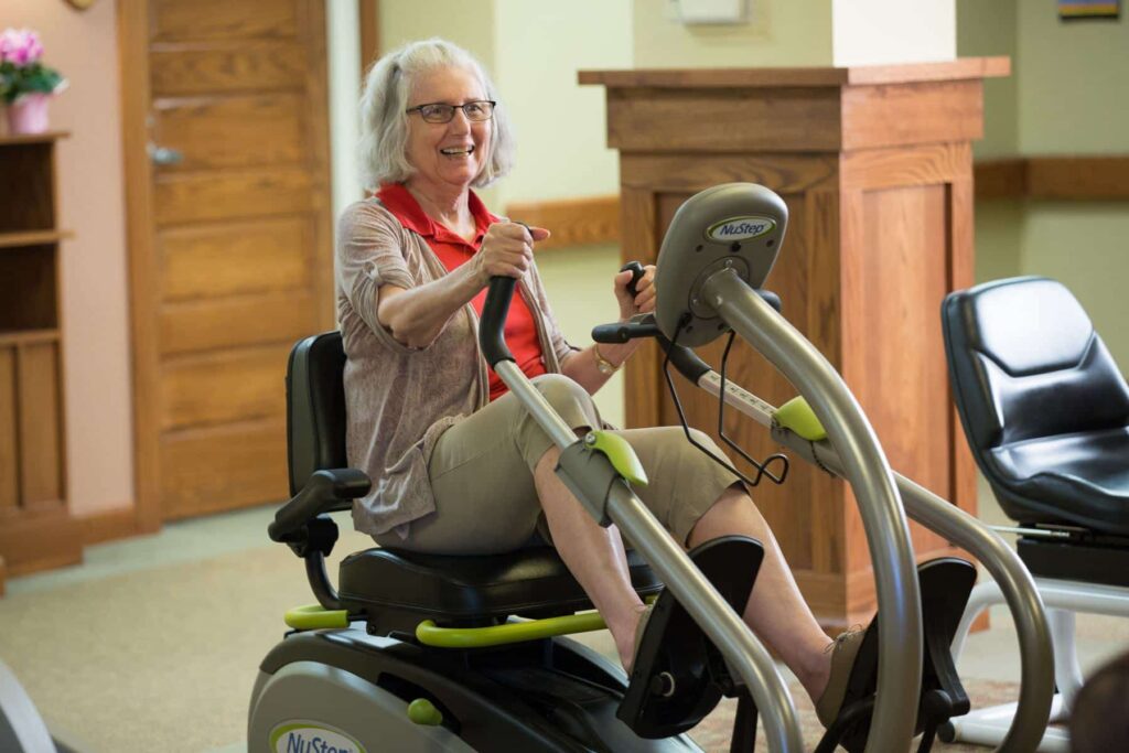 Resident Exercising On Bike