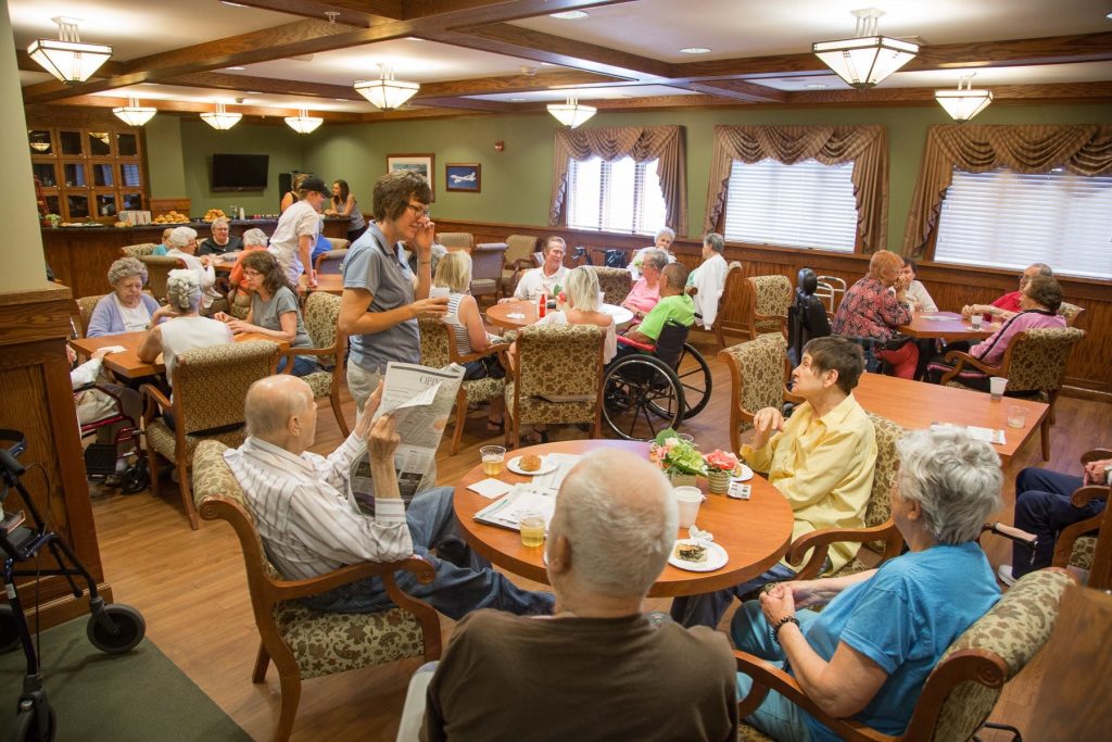 Residents Enjoying Breakfast In The Dining Room