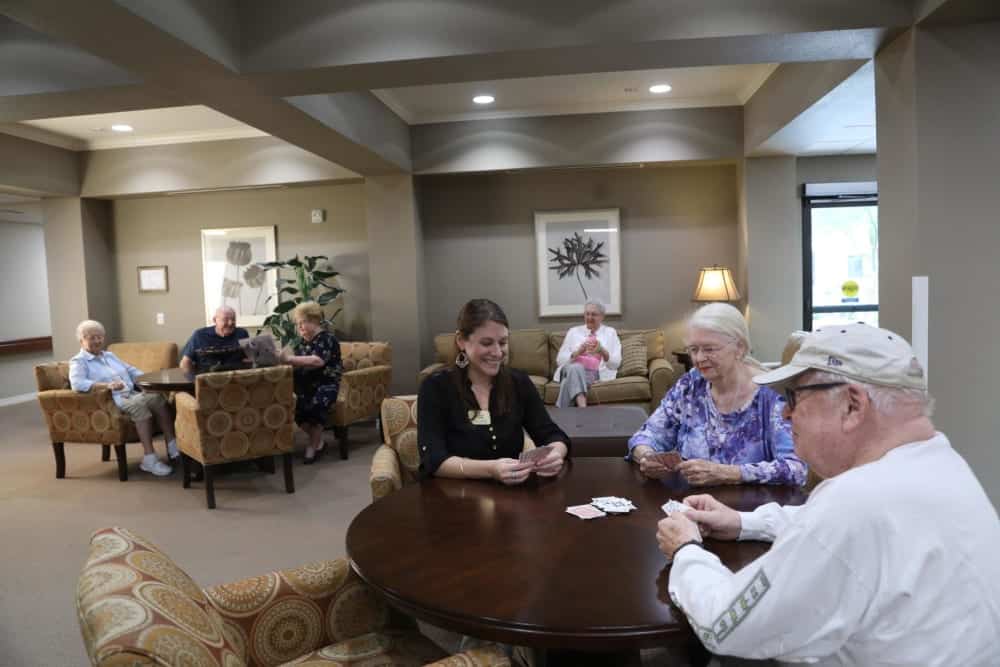 Resident Families Playing Games At Table