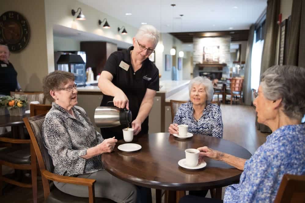 Residents Receiving Coffee From Server