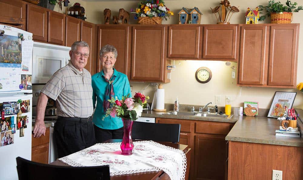 Residents Smiling In Their Kitchen
