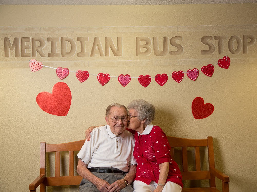Residents Loving Each Other At The Bus Stop