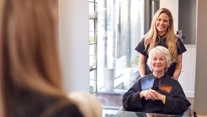 Senior woman with a beautician enjoying the benefits of independent living