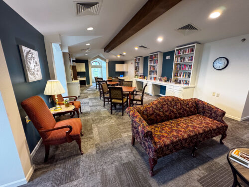 The Heritage at College View Library with desk and chairs