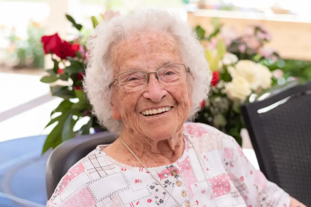 A resident from Orchard Pointe at Surprise retirement community posing for a picture